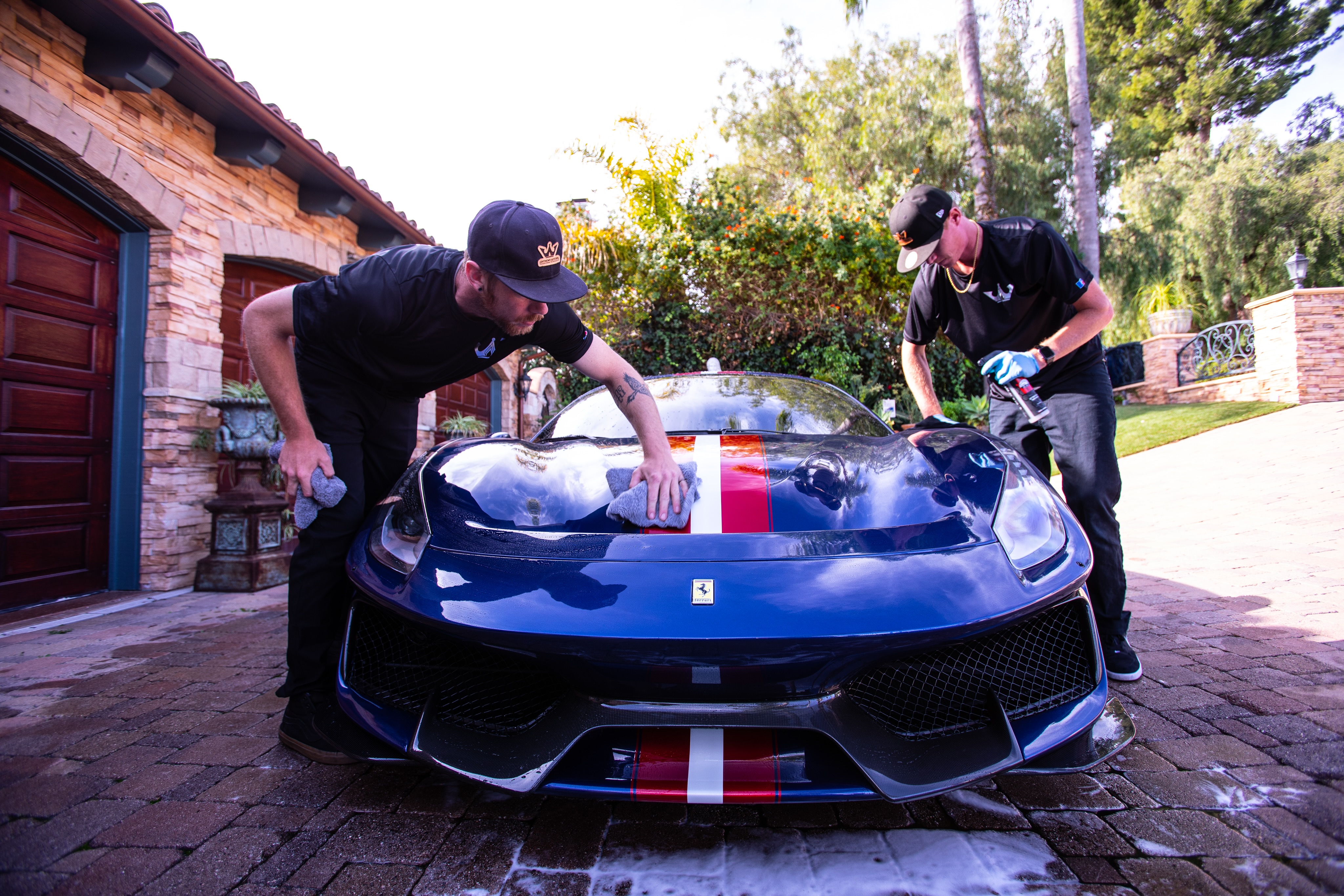 Anthony AutoSpa team detailing a Ferrari at a client location