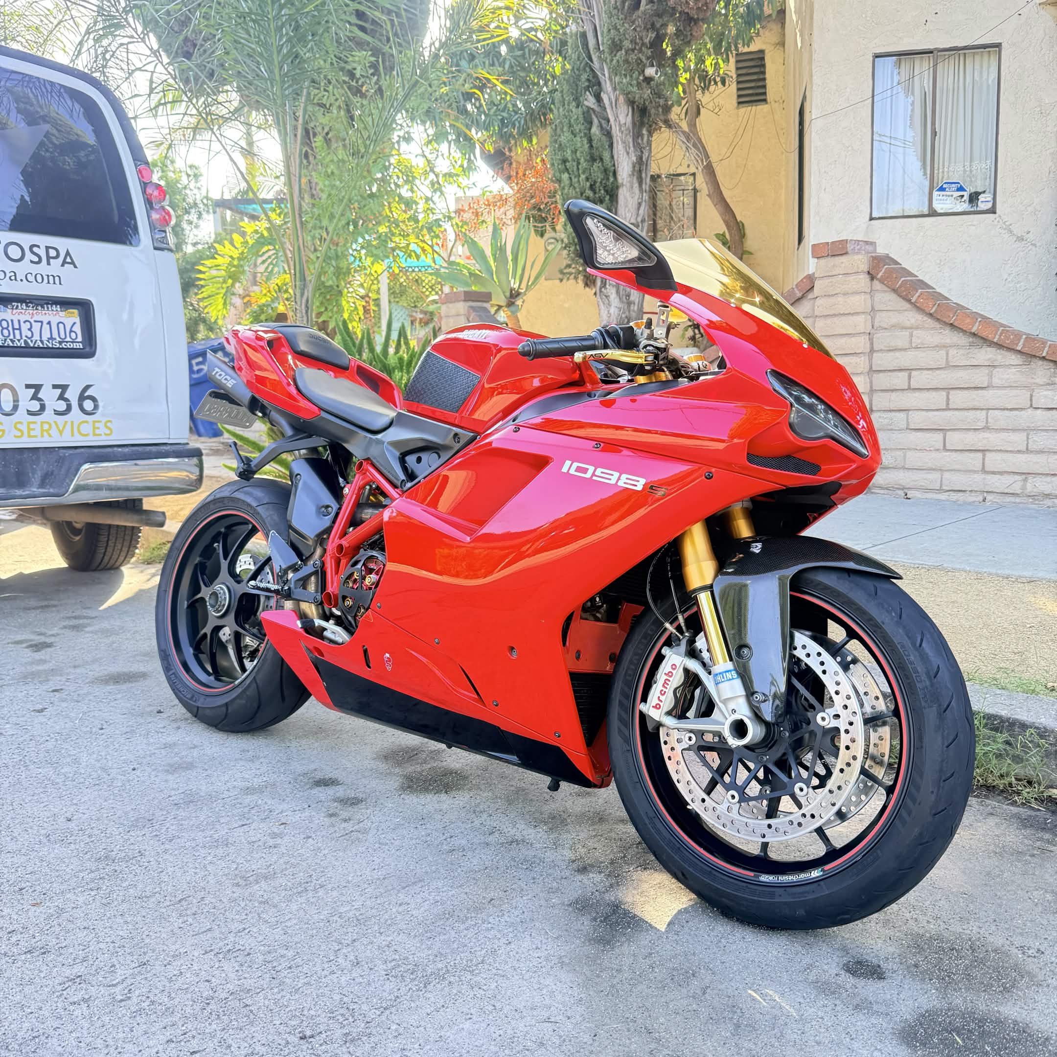 Red Ducati motorcycle after a premium motorcycle detail in Belmont Shore